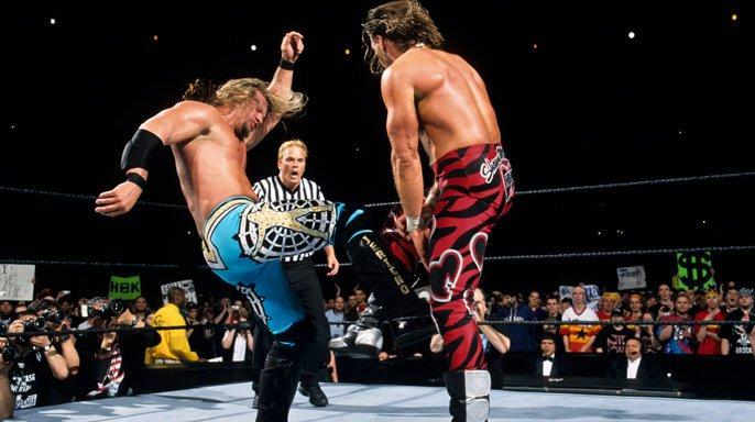 Chris Jericho and Shawn Michaels wrestle in the ring during WrestleMania 19